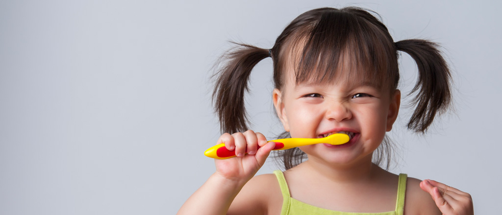 child brushing teeth